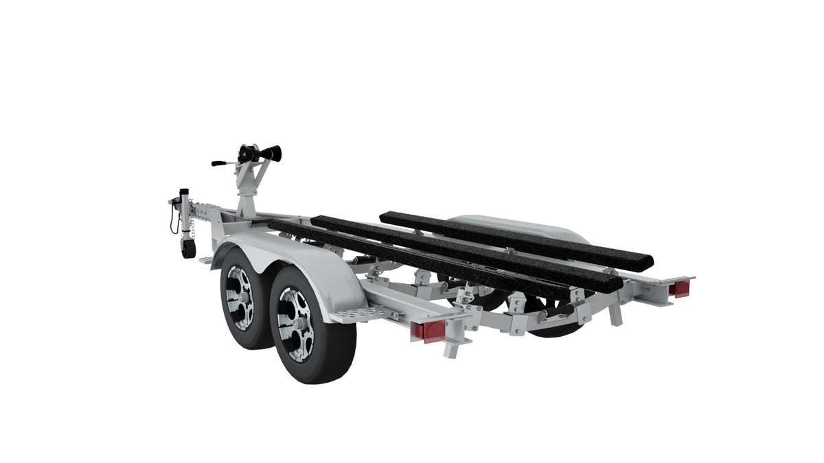 Rear quarter view of a tandem axle aluminum boat trailer with tail lights and carpeted bunks